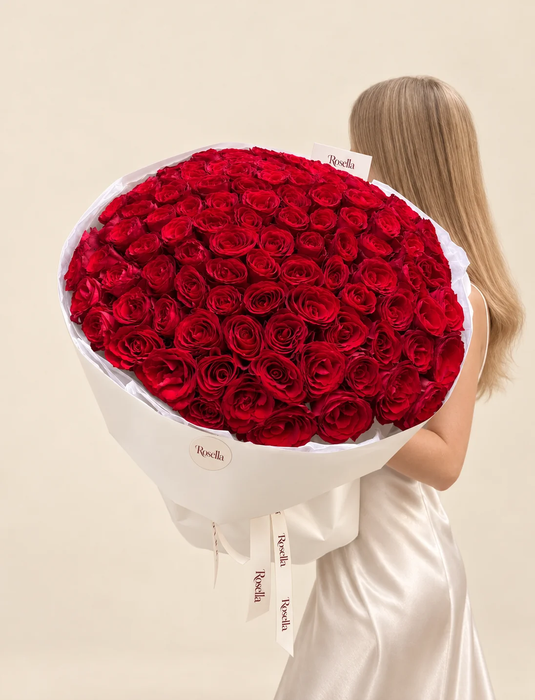 115 roses in a hand-tied bouquet