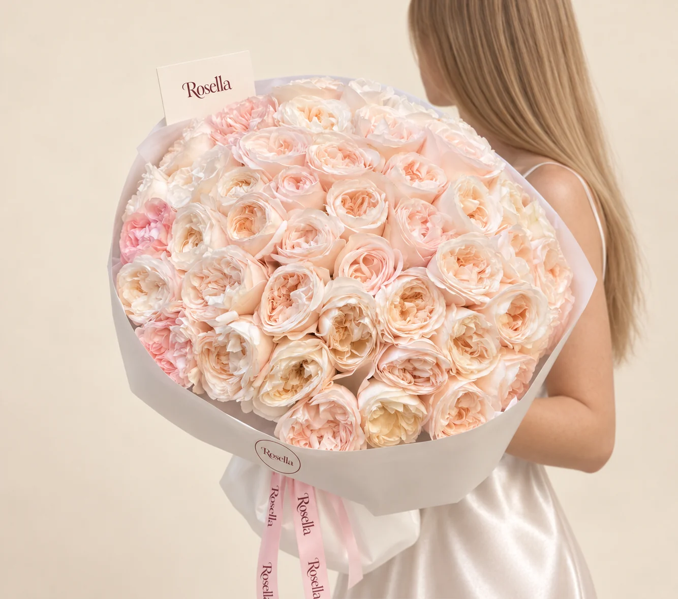 28 blush garden roses & 21 ivory garden roses in a hand-tied bouquet