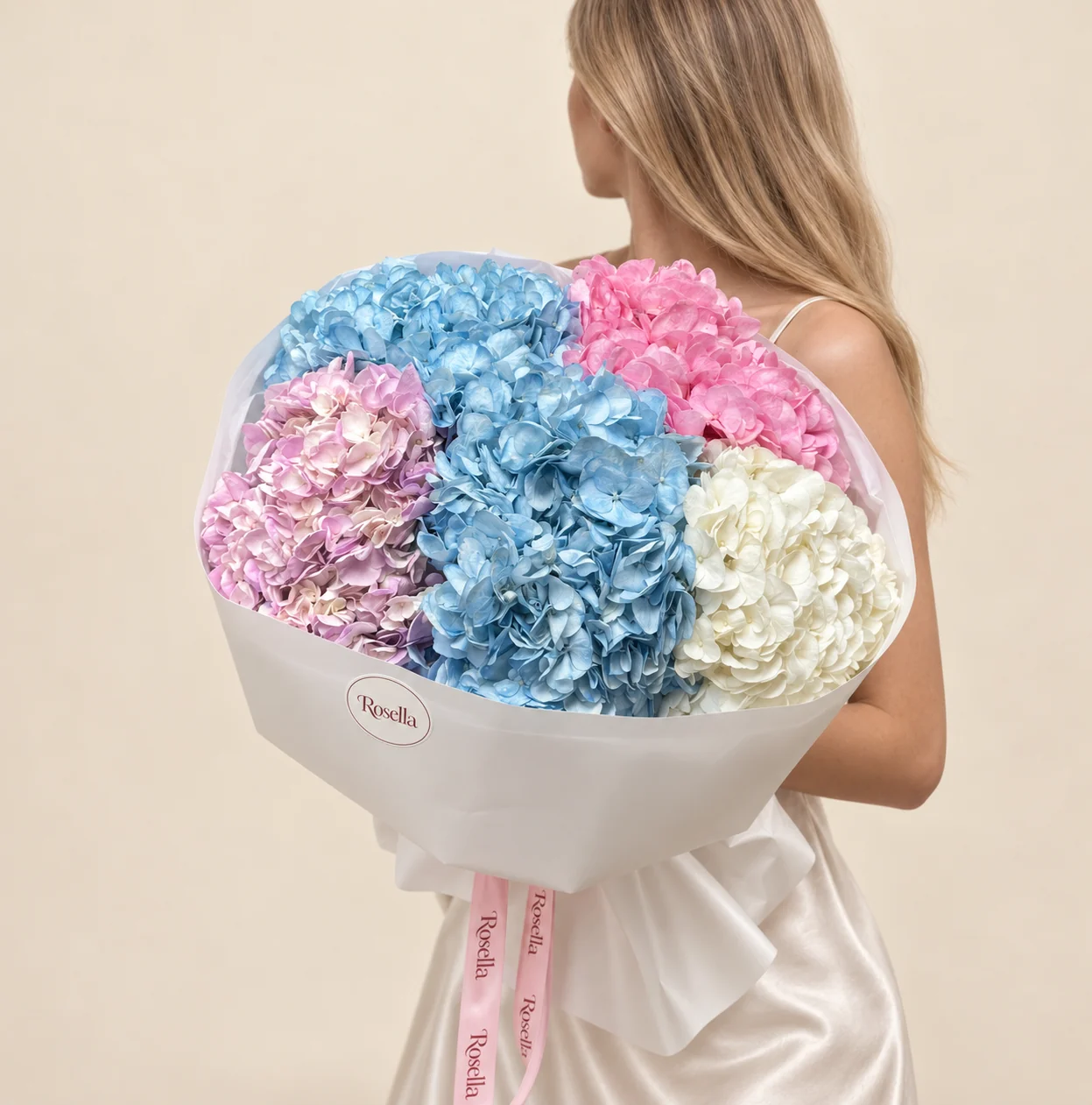 2 blue hydrangeas, 1 pink hydrangea, 1 lilac hydrangea & 1 white hydrangea in a hand-tied bouquet