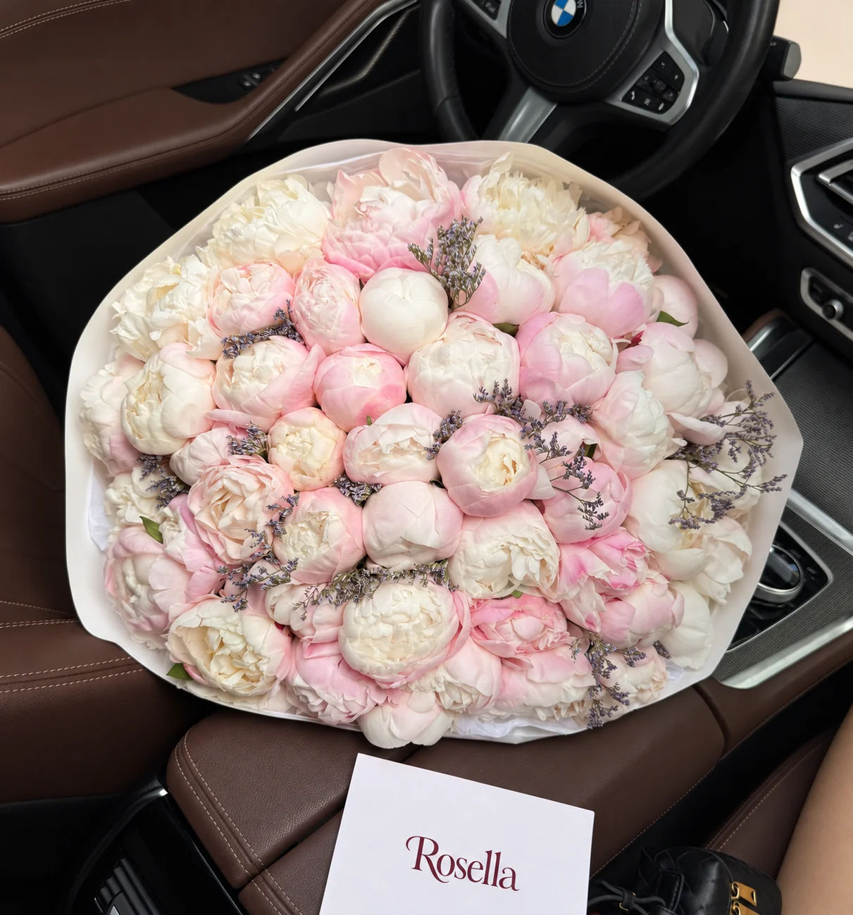 39 blush peonies & 11 ivory peonies in a hand-tied bouquet