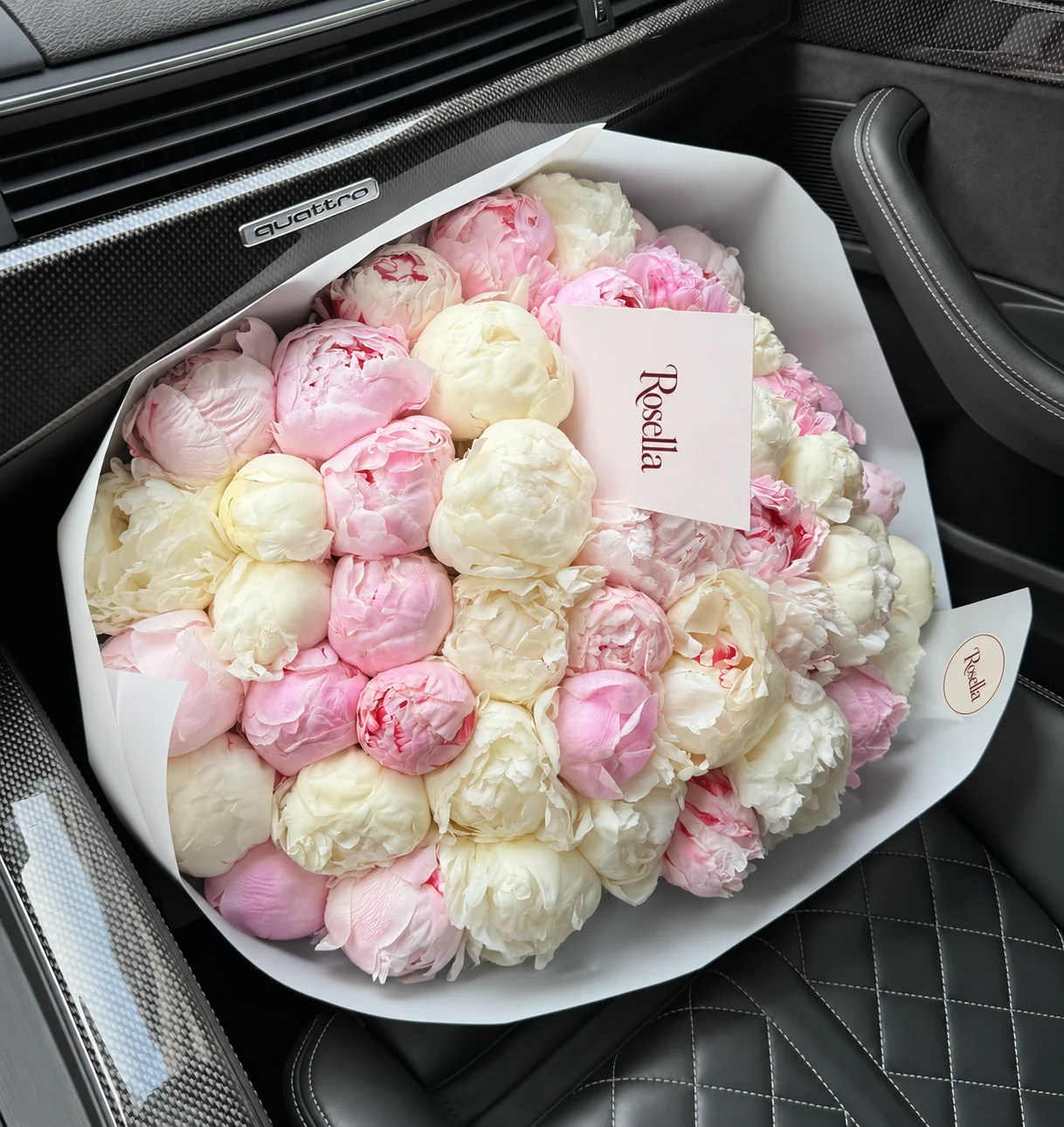 27 pink peonies & 24 white peonies in a hand-tied bouquet