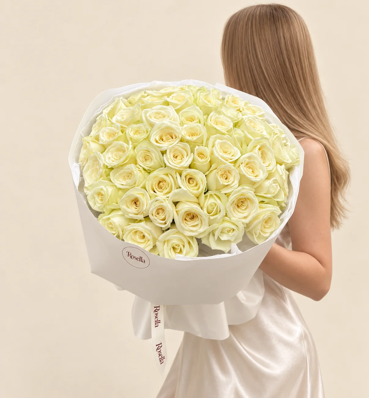 55 roses in a hand-tied bouquet
