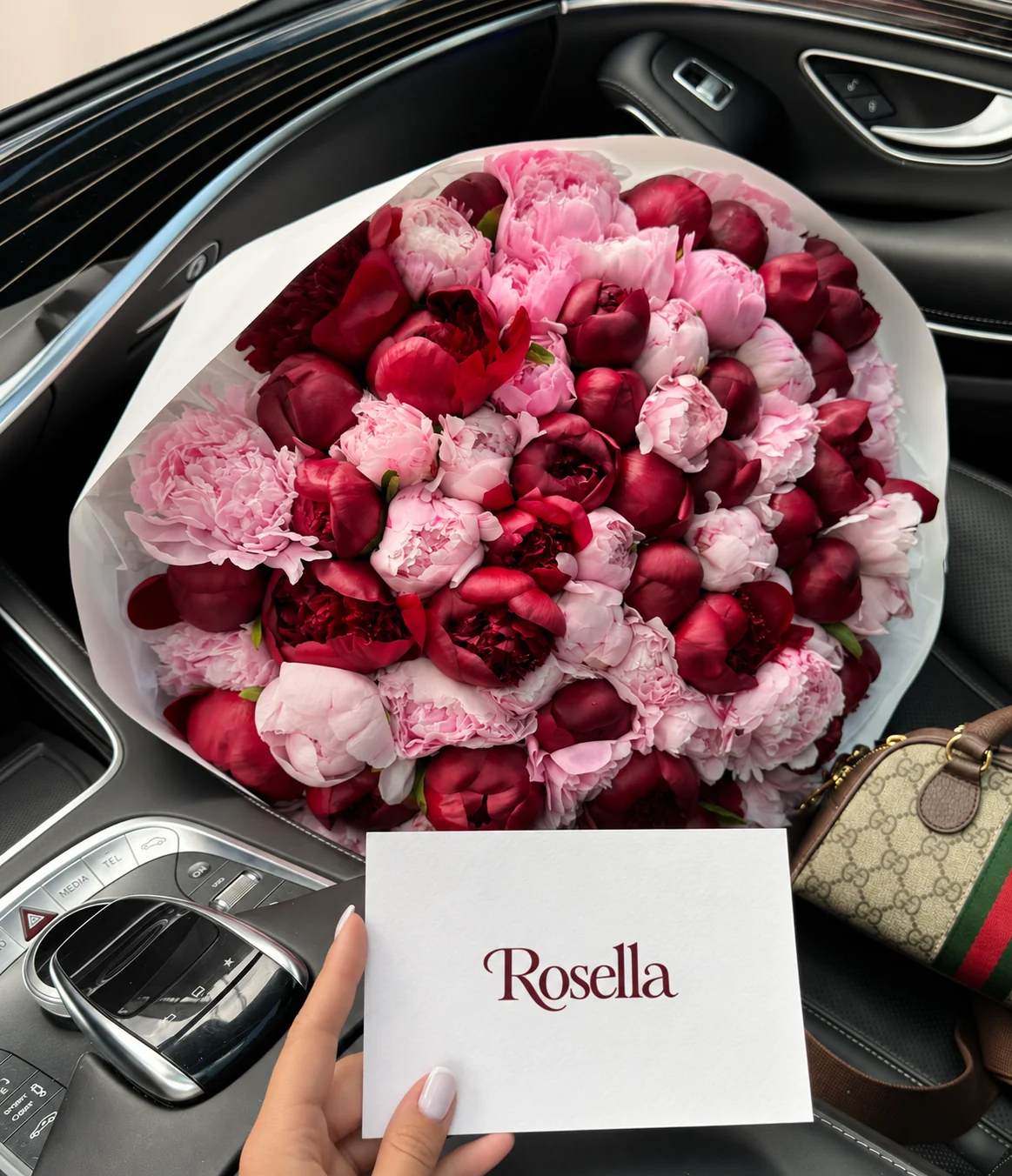 41 burgundy peonies & 34 pink peonies in a hand-tied bouquet