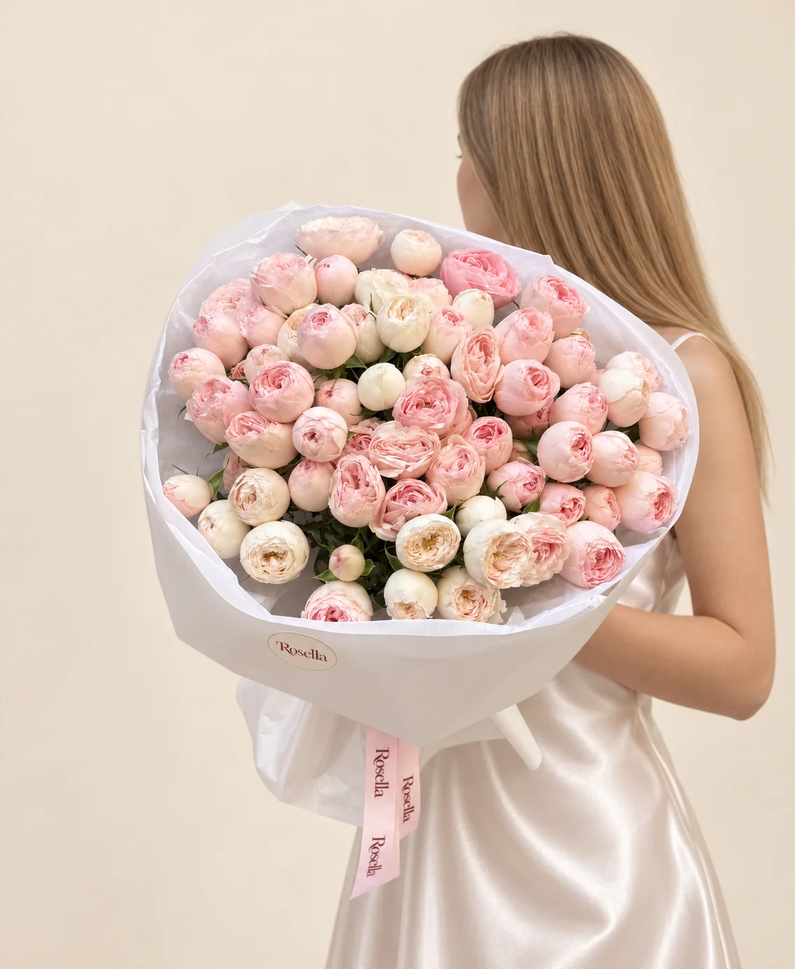 60 blush spray roses & 20 cream spray roses in a hand-tied bouquet
