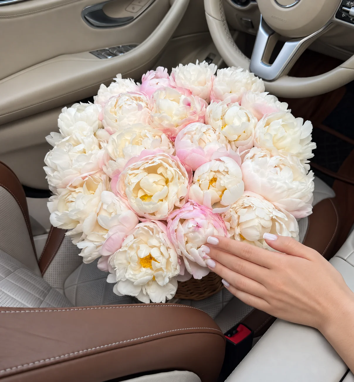 25 peonies in a basket