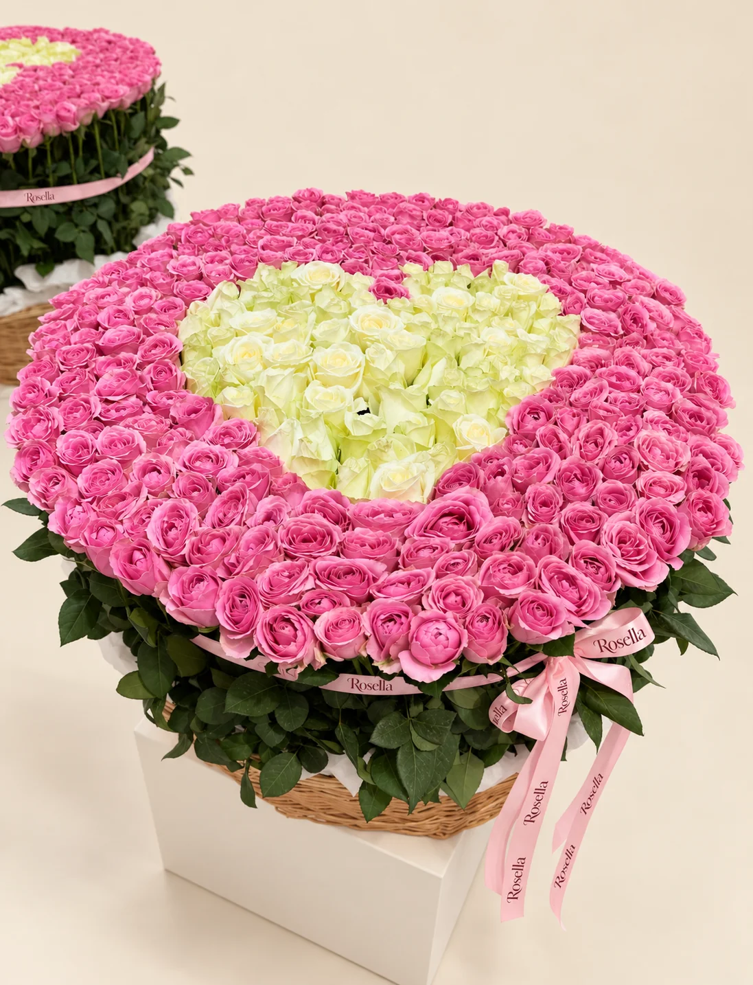 215 pink roses & 80 ivory roses in a basket