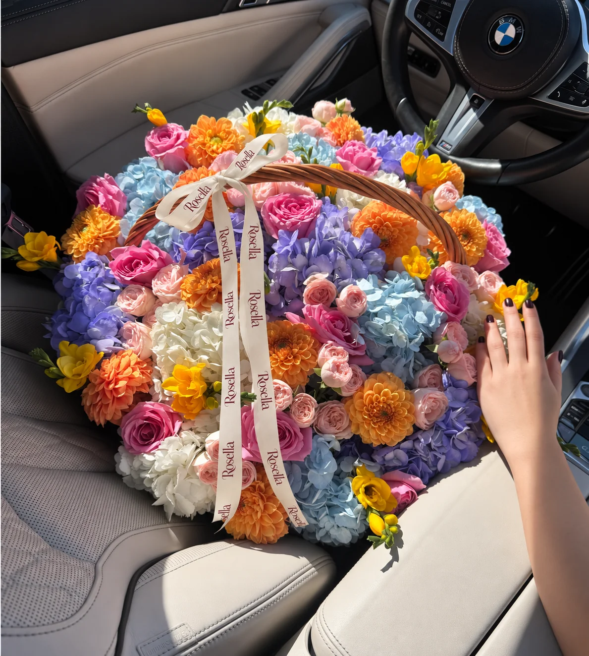 15 dahlias, 6 blue hydrangeas, 6 lavender hydrangeas, 6 white hydrangeas, 36 spray roses, 14 roses & 6 freesias in a basket