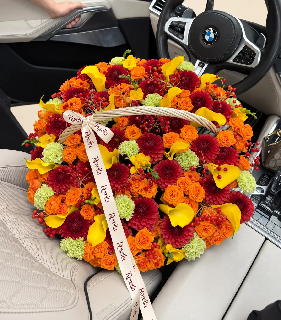 33 dahlias, 78 spray roses, 18 callas, 18 carnations & 5 freesias in a basket