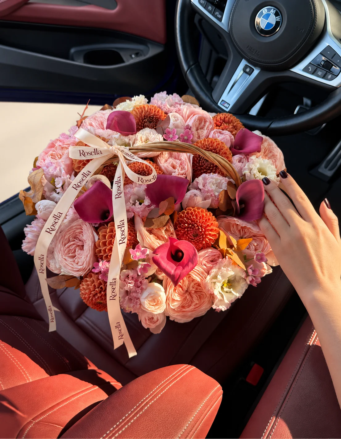15 garden roses, 10 dahlias, 18 pink lisianthus blooms, 4 roses, 6 callas, 10 white lisianthus blooms & 14 tweedia blooms in a basket
