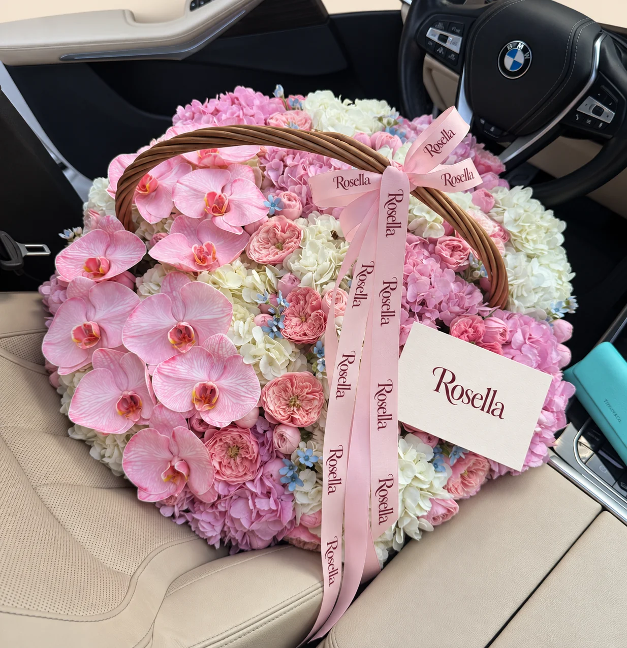 30 garden roses, 12 white hydrangeas, 10 pink hydrangeas, 12 orchid blooms & 30 tweedia blooms in a basket
