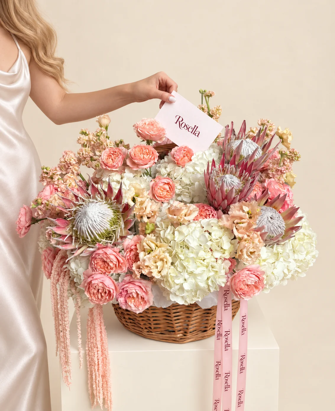 25 garden roses, 8 hydrangeas, 6 stocks, 4 pink king protea & 23 lisianthus blooms in a basket