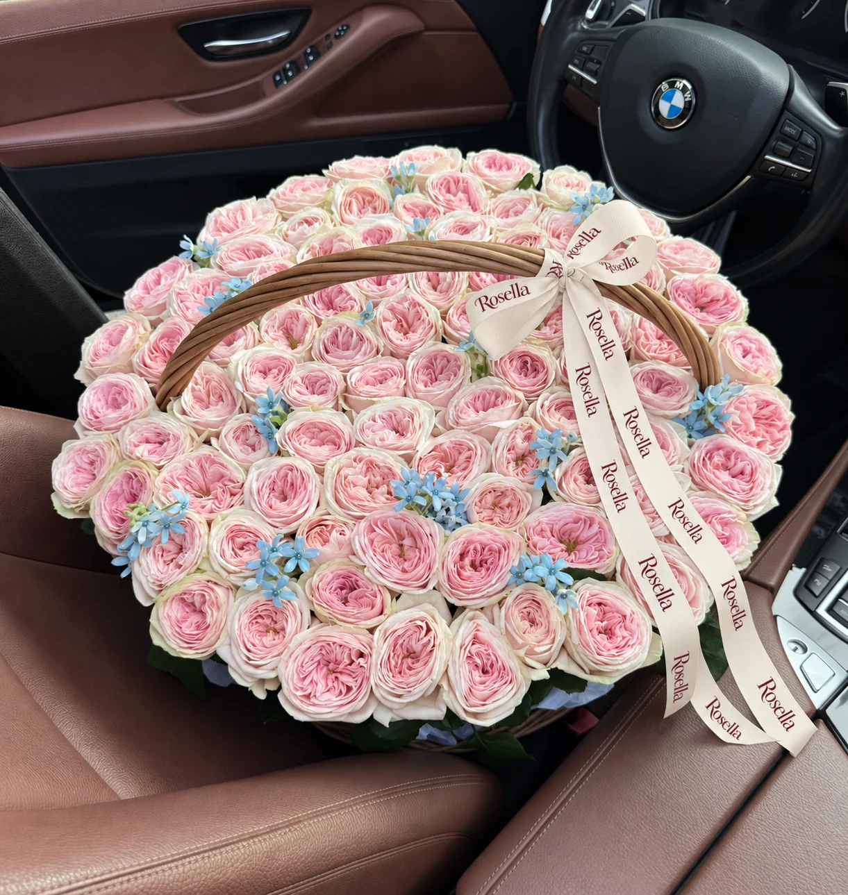 94 garden roses & 54 tweedia blooms in a basket