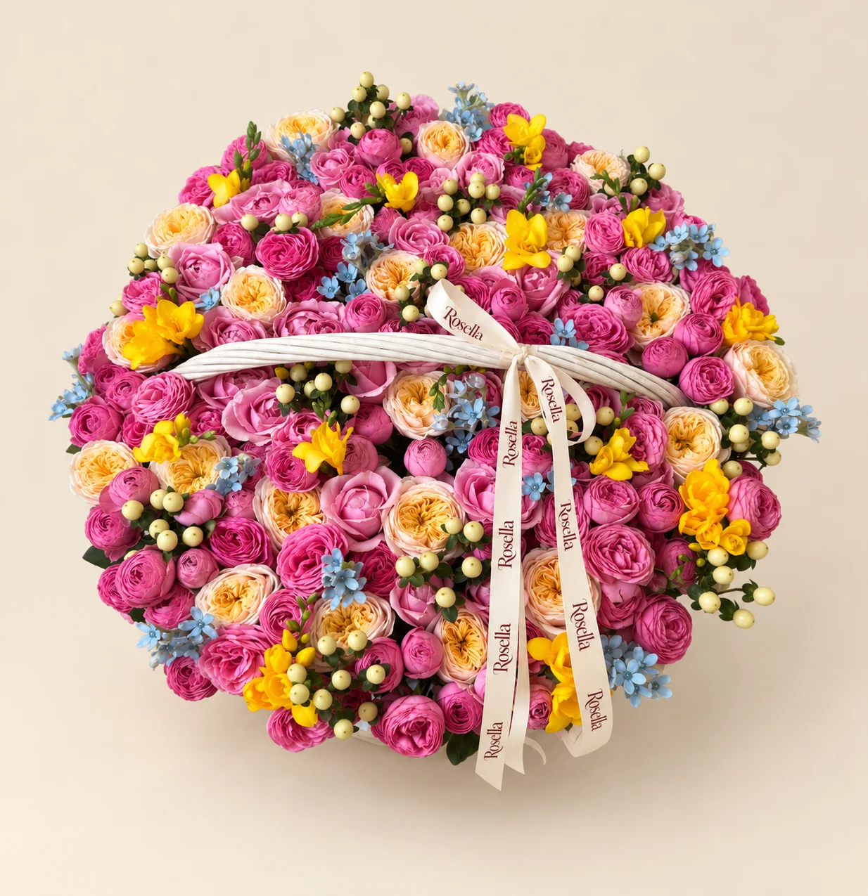 27 garden roses, 94 pink spray roses, 36 pink spray roses, 90 tweedia blooms & 11 freesias in a basket