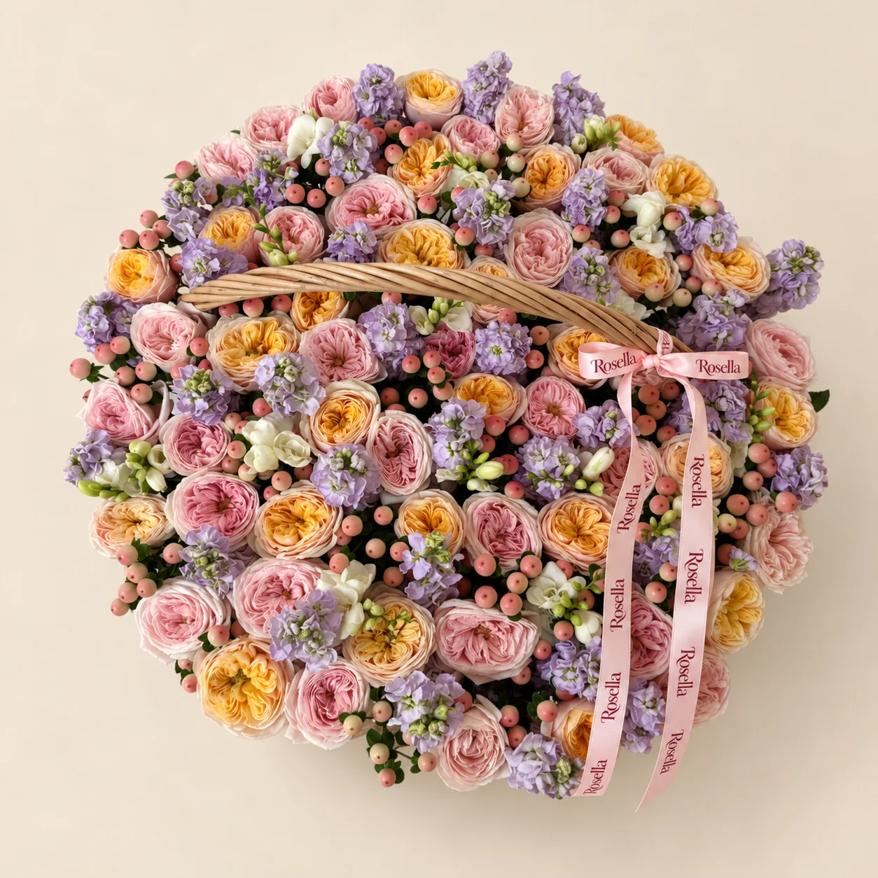 35 blush garden roses, 31 yellow garden roses, 20 stocks & 9 freesias in a basket