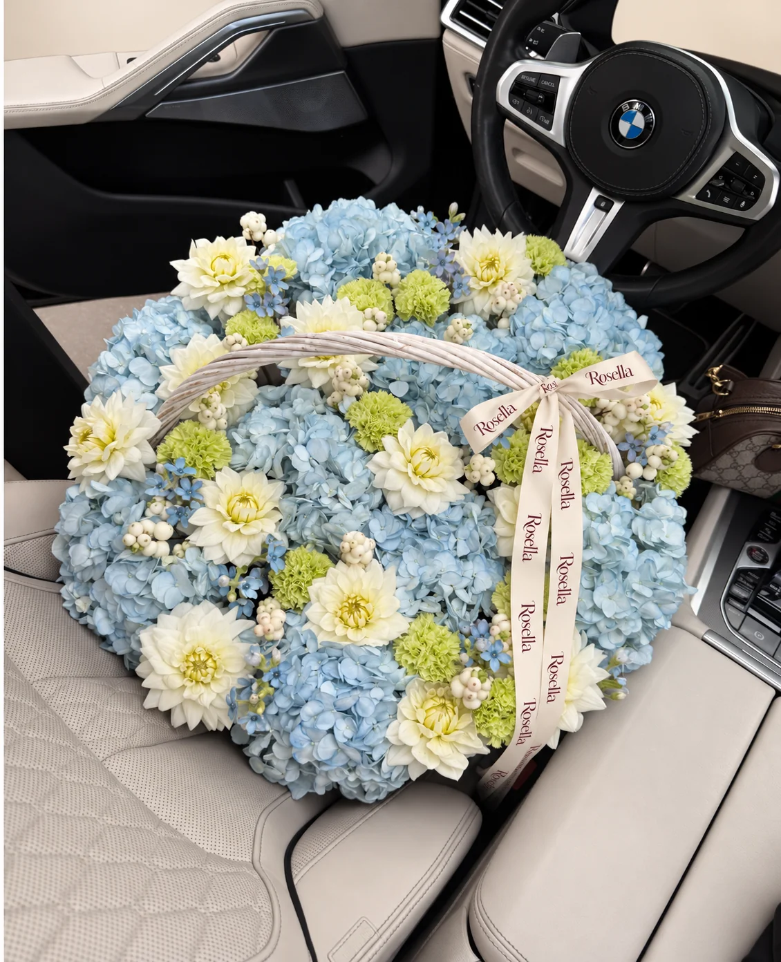 12 hydrangeas, 15 dahlias, 19 carnations & 48 tweedia blooms in a basket