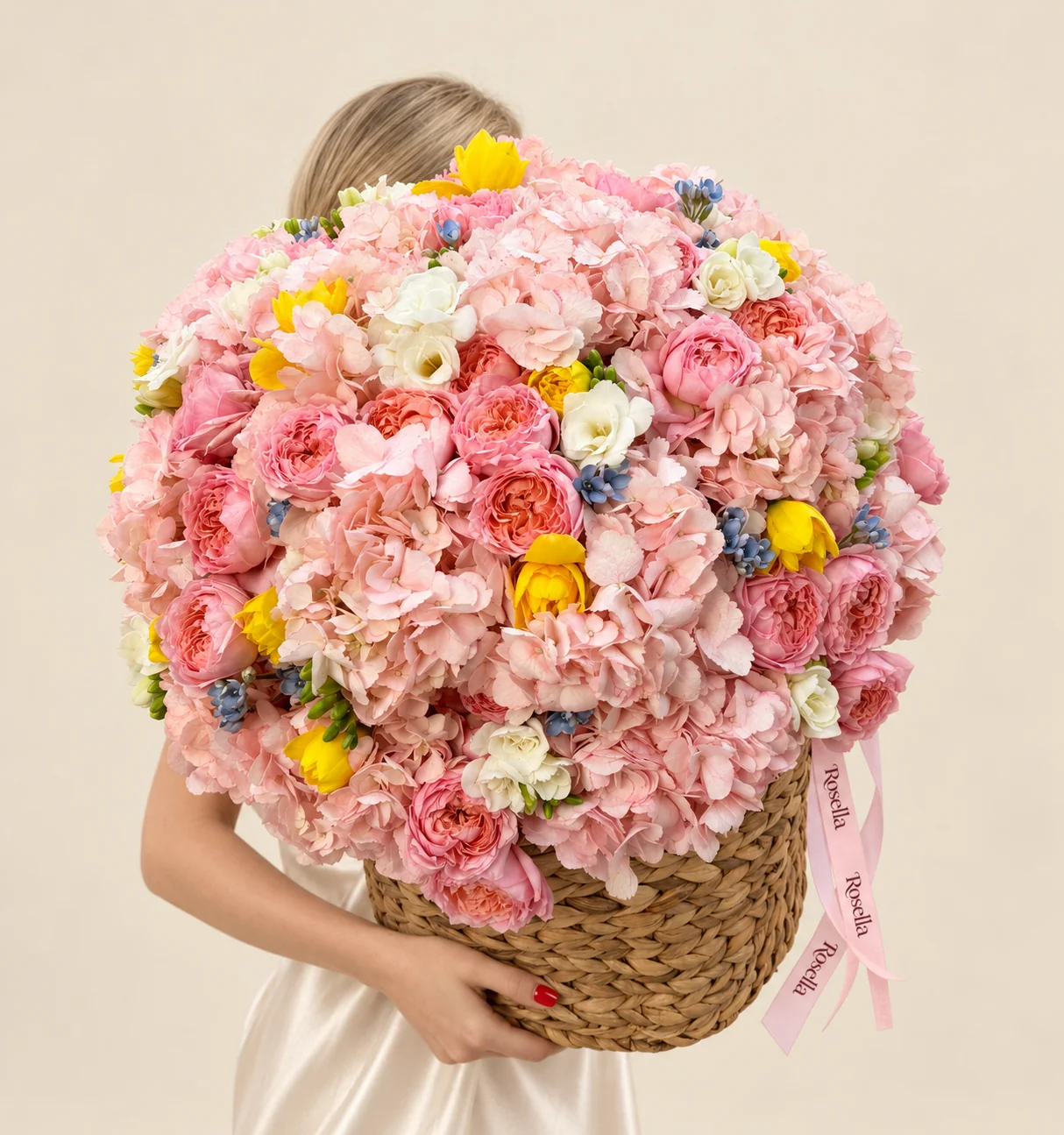 14 hydrangeas, 24 garden roses, 15 yellow daffodil / narcissus, 29 tweedia blooms & 5 freesias in a basket