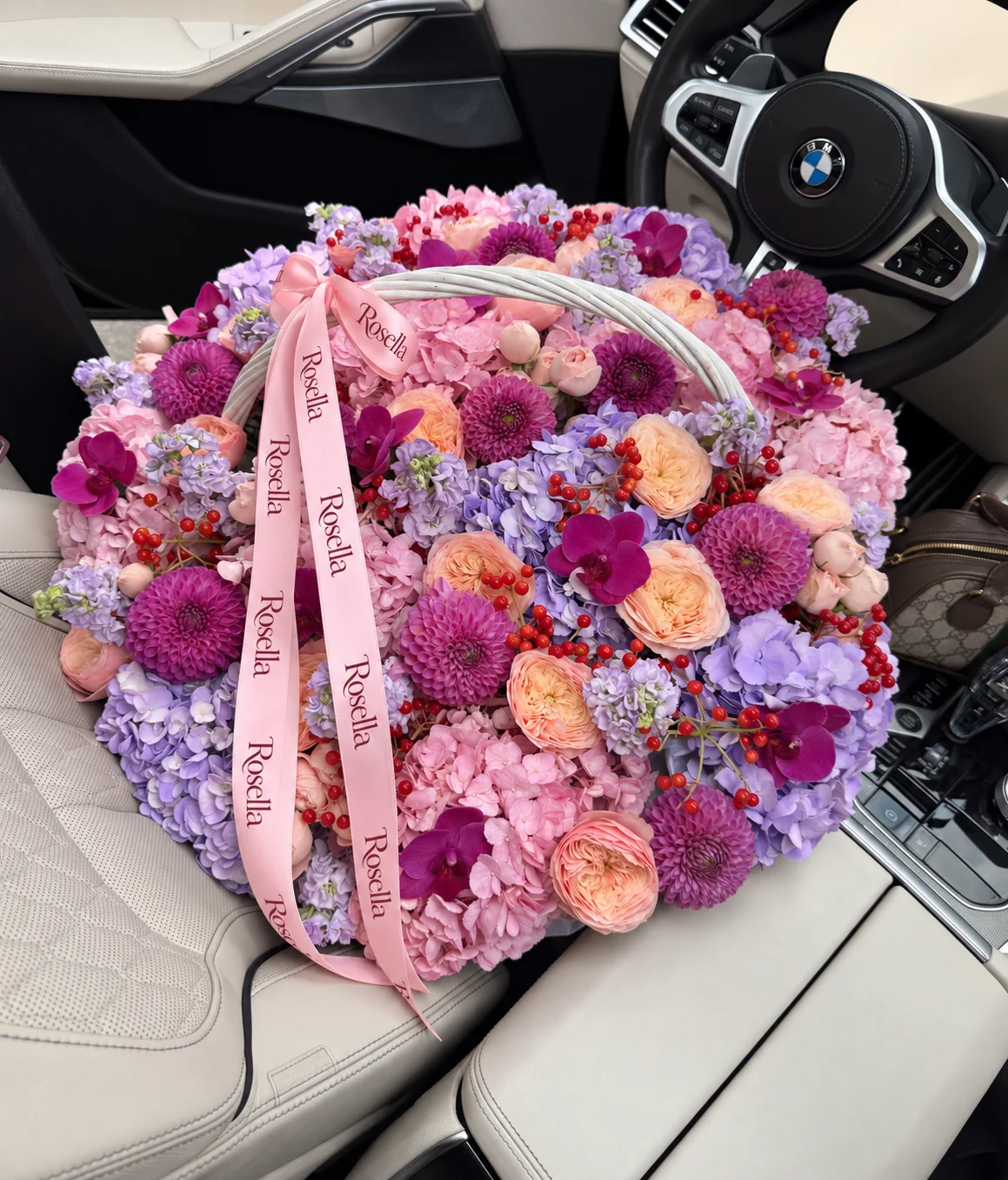 10 pink hydrangeas, 8 lavender hydrangeas, 18 garden roses, 12 dahlias, 7 stocks, 11 orchid blooms & 16 spray roses in a basket