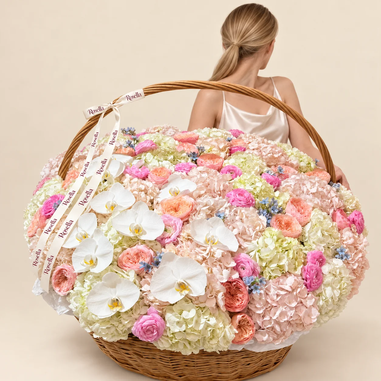 17 cream hydrangeas, 16 blush hydrangeas, 22 garden roses, 13 ranunculus, 10 orchid blooms, 6 roses & 45 tweedia blooms in a basket