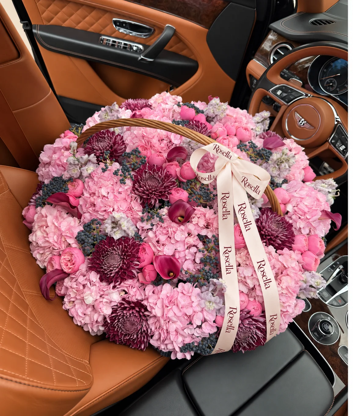 17 hydrangeas, 40 garden roses, 12 chrysanthemums, 5 stocks & 10 callas in a basket