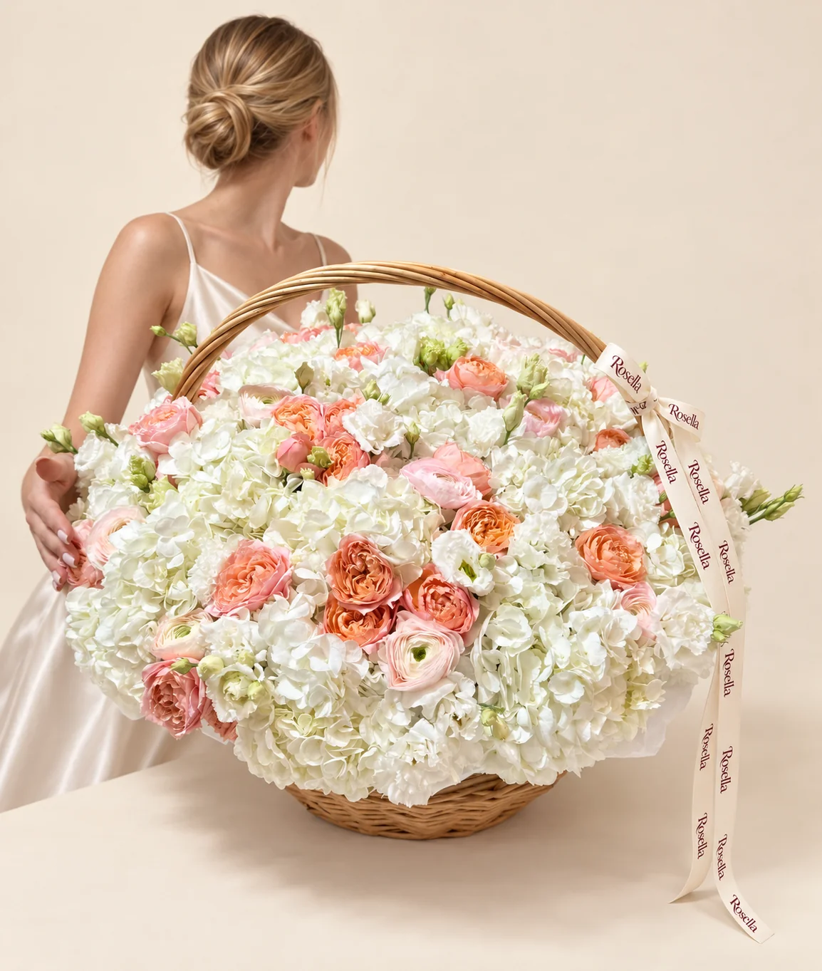 16 hydrangeas, 20 peach garden roses, 34 lisianthus blooms, 6 pink garden roses & 10 ranunculus in a basket