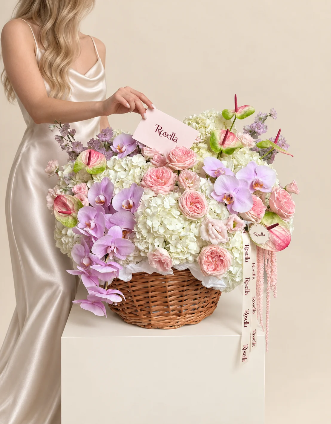 10 hydrangeas, 11 garden roses, 16 orchid blooms, 7 anthuriums, 16 pale lilac sweet peas & 11 lisianthus blooms in a basket
