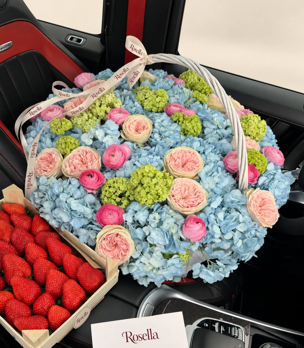 20 hydrangeas, 15 garden roses, 13 pink ranunculus, 14 lime-green viburnum snowball clusters & 5 pink ranunculus in a basket