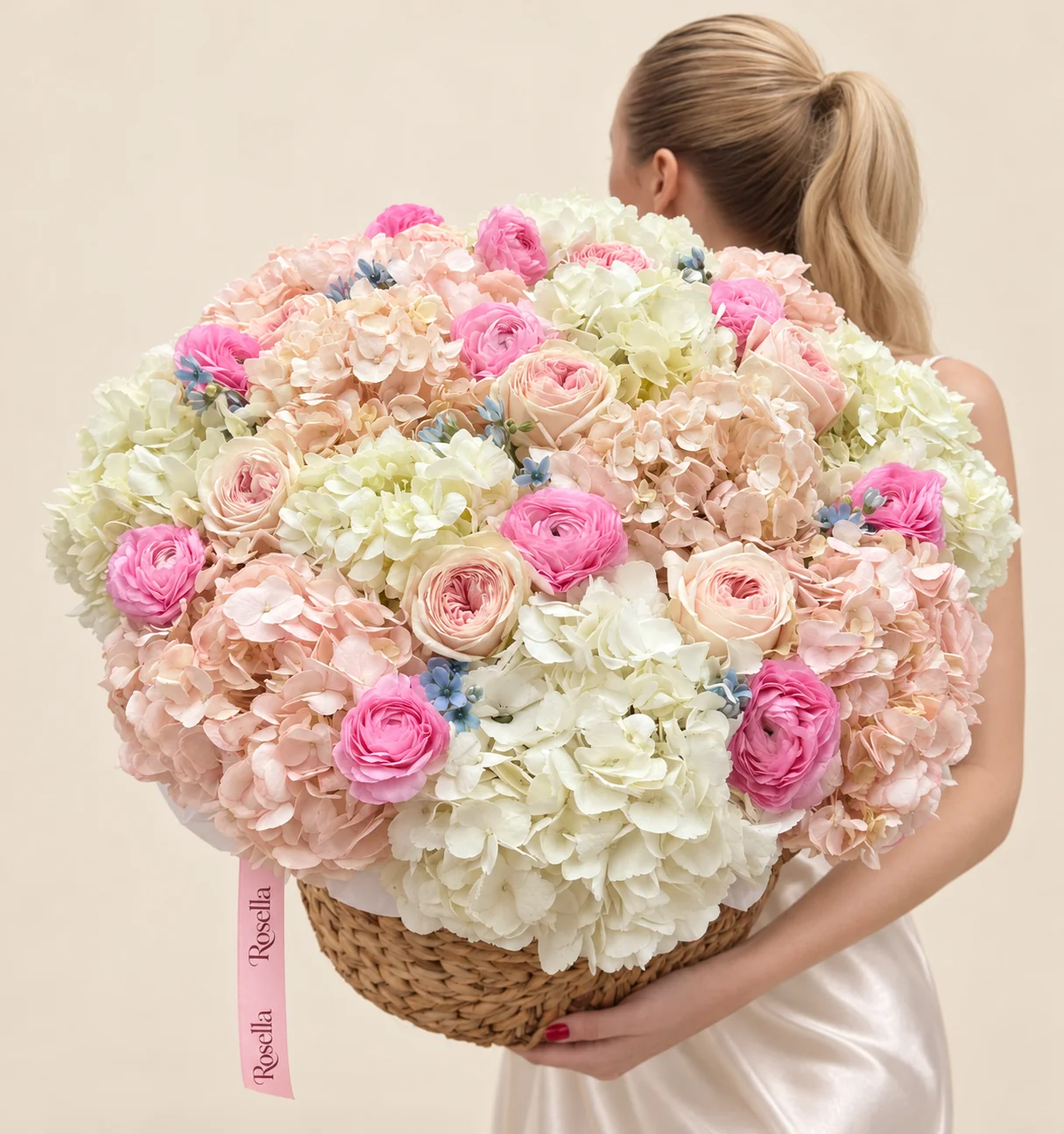 8 ivory hydrangeas, 8 blush hydrangeas, 8 garden roses, 14 ranunculus & 18 tweedia blooms in a basket