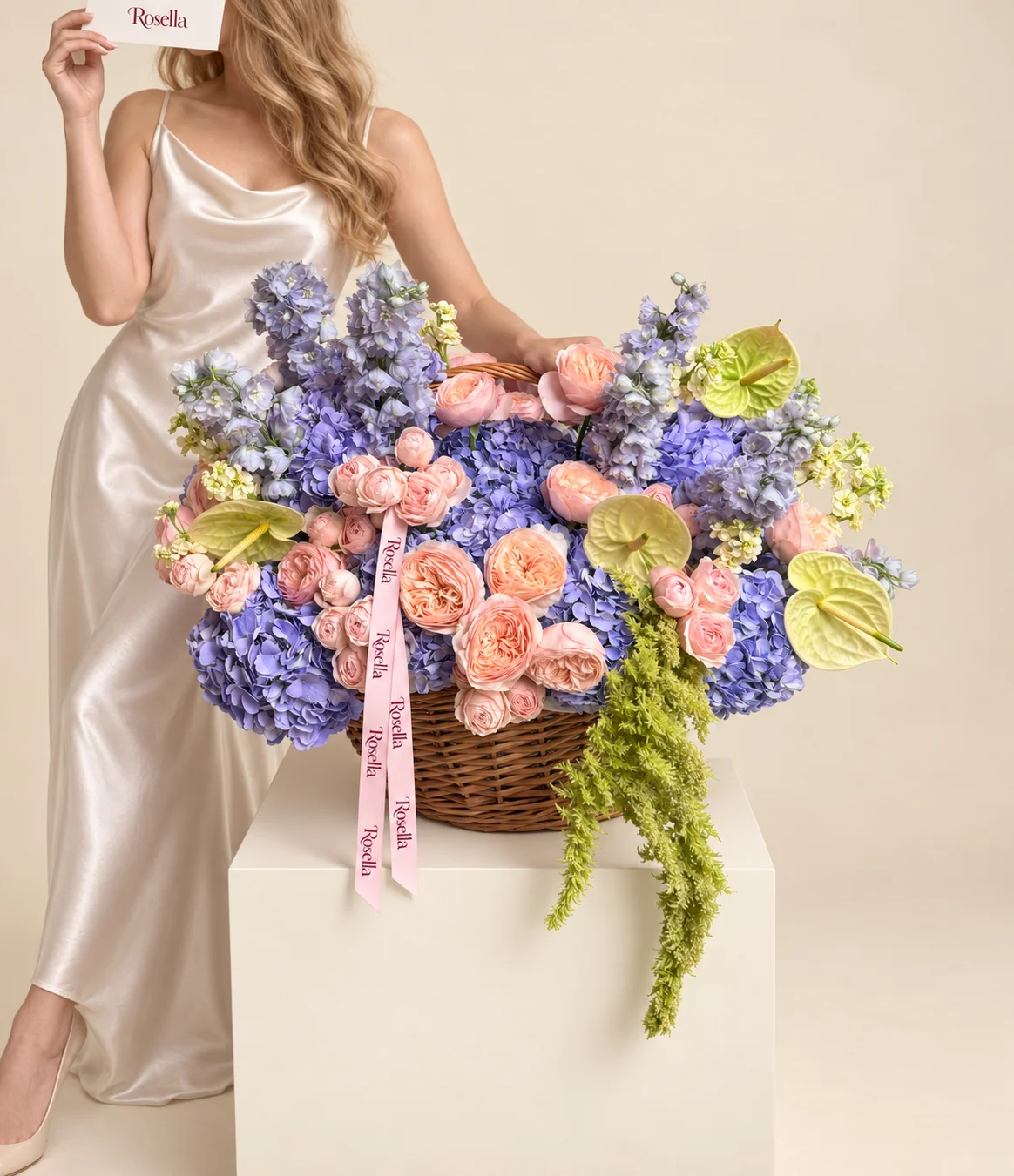 10 hydrangeas, 12 garden roses, 30 spray roses, 5 delphiniums, 3 stocks & 5 anthuriums in a basket