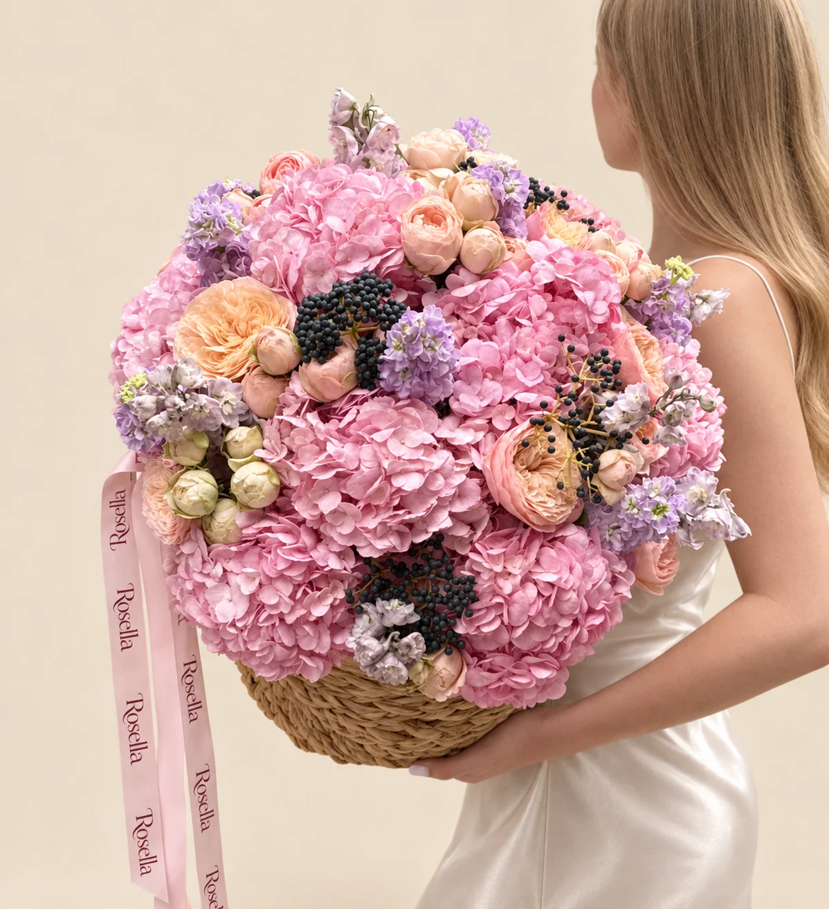 11 hydrangeas, 12 garden roses, 6 stocks, 6 roses, 9 blush spray roses & 6 ivory spray roses in a basket