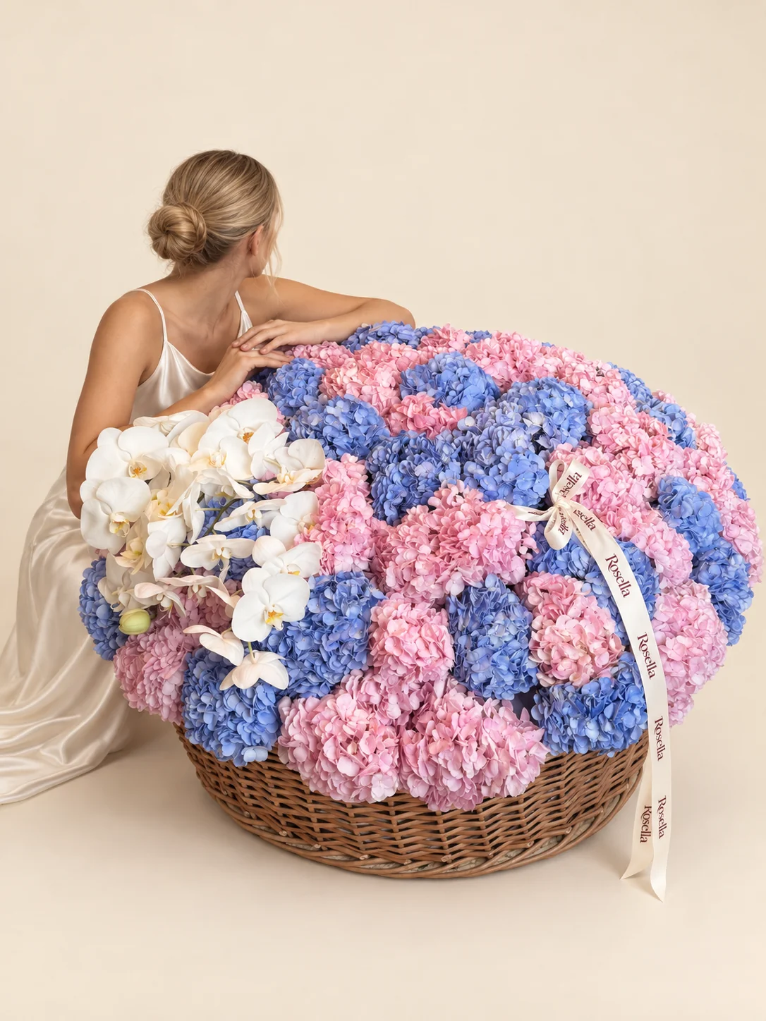 29 pink hydrangeas, 25 blue hydrangeas & 20 orchid blooms in a basket