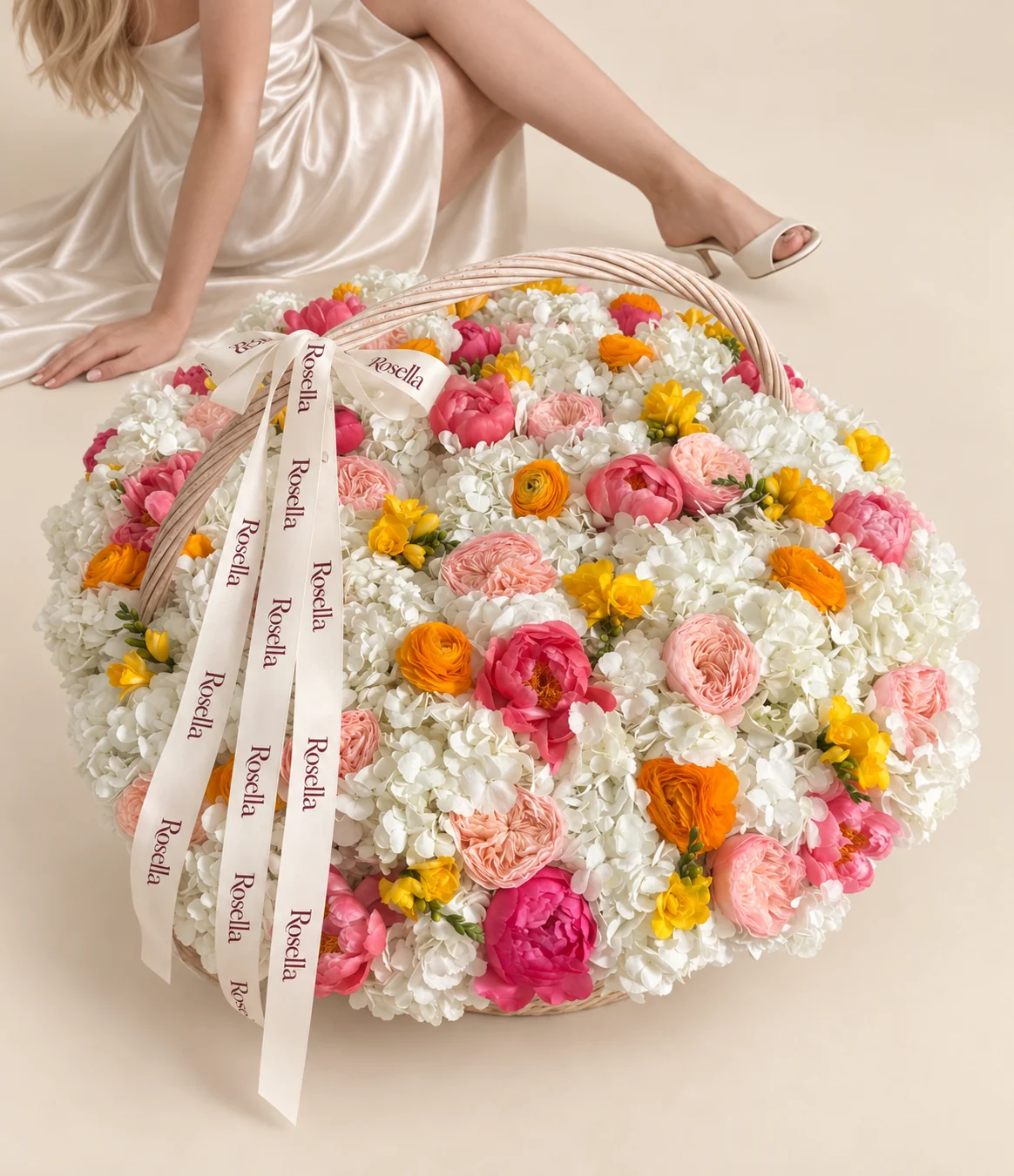 30 hydrangeas, 17 coral peonies, 14 garden roses, 11 ranunculus, 13 freesias & 1 pink peony in a basket