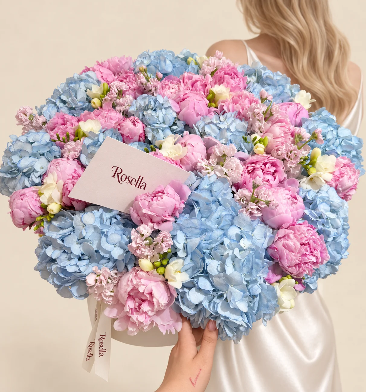 14 hydrangeas, 25 peonies, 6 stocks & 8 freesias in a basket