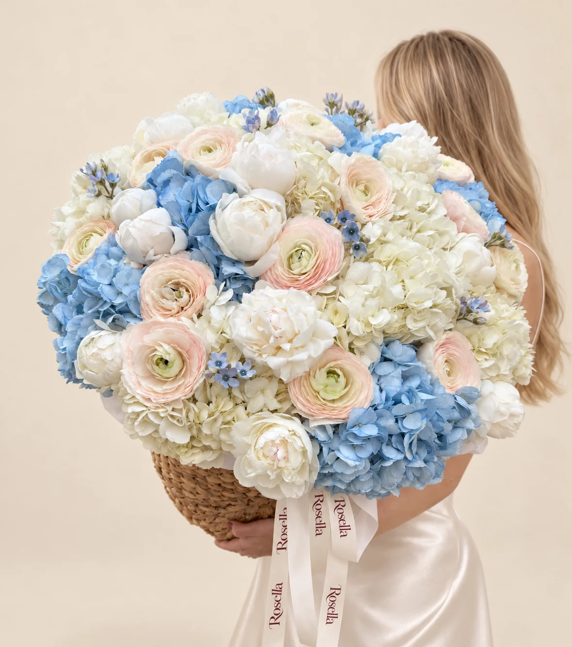 9 white hydrangeas, 8 blue hydrangeas, 15 peonies, 15 ranunculus & 26 tweedia blooms in a basket