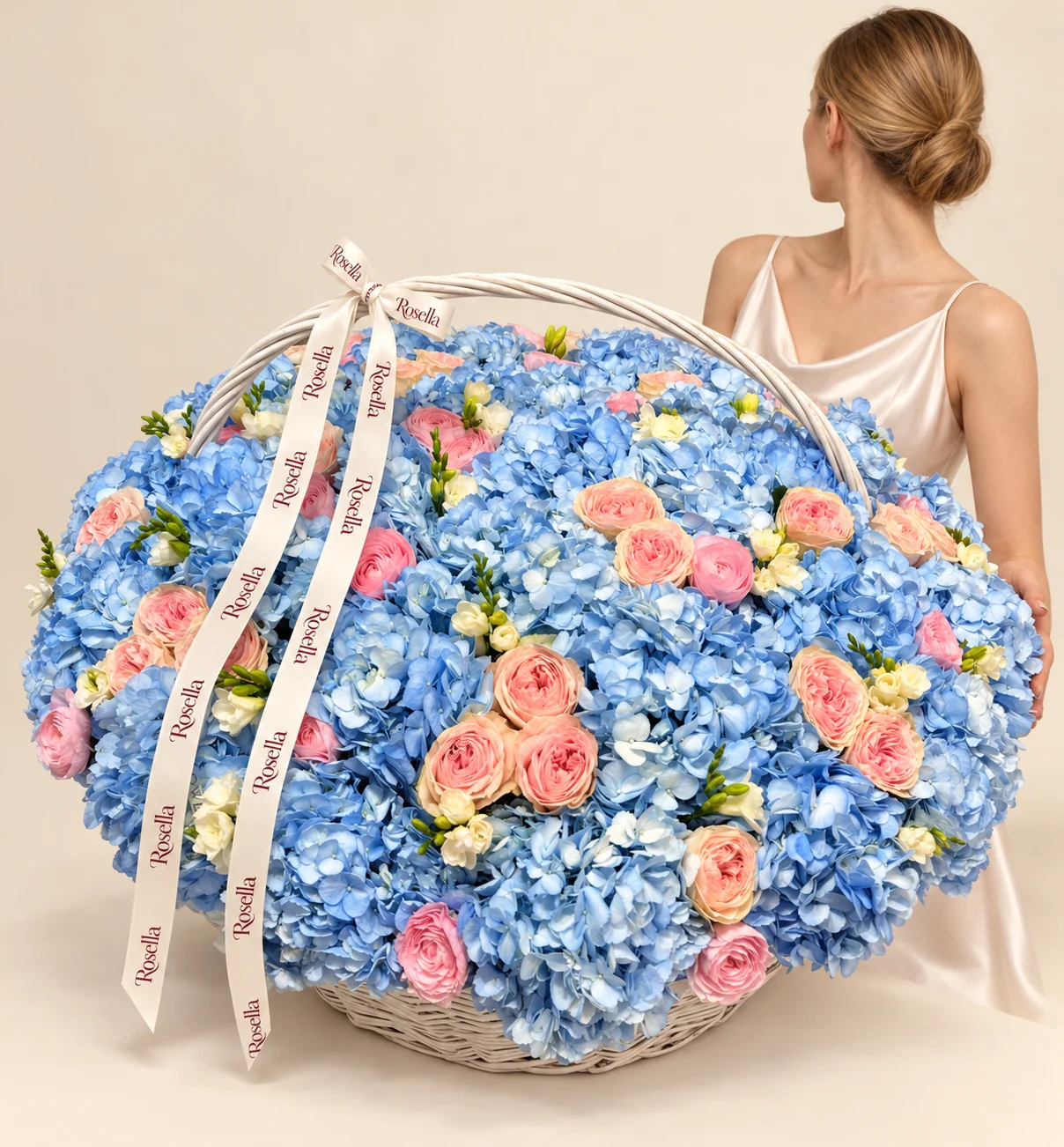 45 hydrangeas, 24 peach ranunculus, 18 pink ranunculus & 13 freesias in a basket