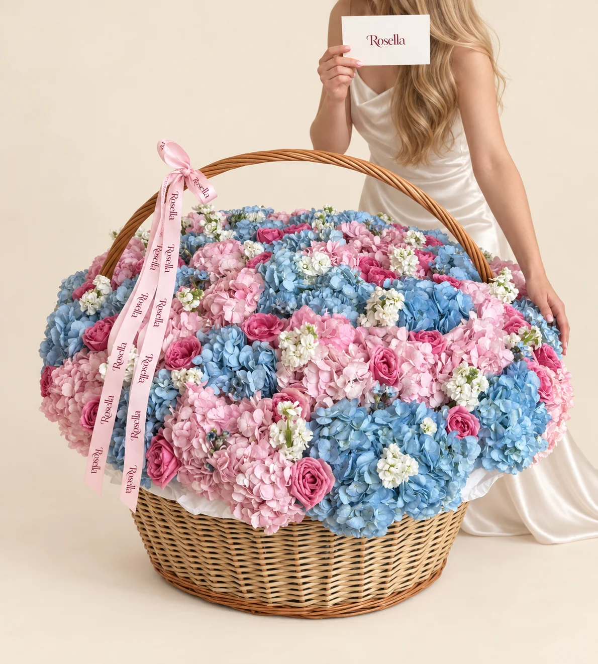 28 blue hydrangeas, 22 pink hydrangeas, 32 roses & 10 stocks in a basket