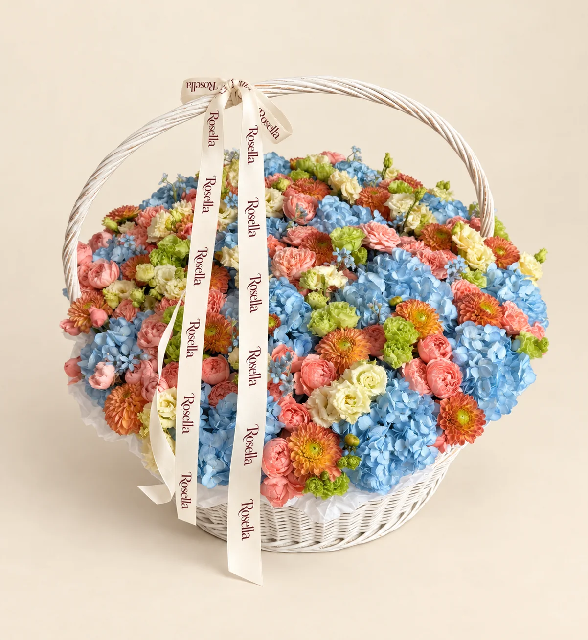 20 hydrangeas, 63 spray roses, 21 chrysanthemums, 29 green lisianthus blooms, 28 cream lisianthus blooms & 34 tweedia blooms in a basket