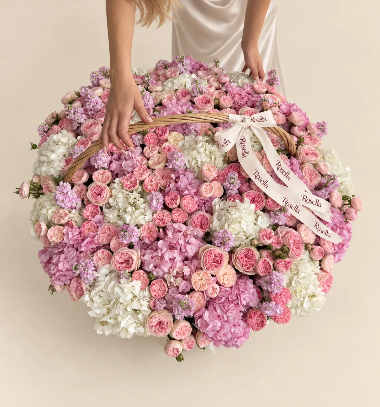 19 pink hydrangeas, 14 white hydrangeas, 90 blush spray roses, 58 pink spray roses & 13 stocks in a basket