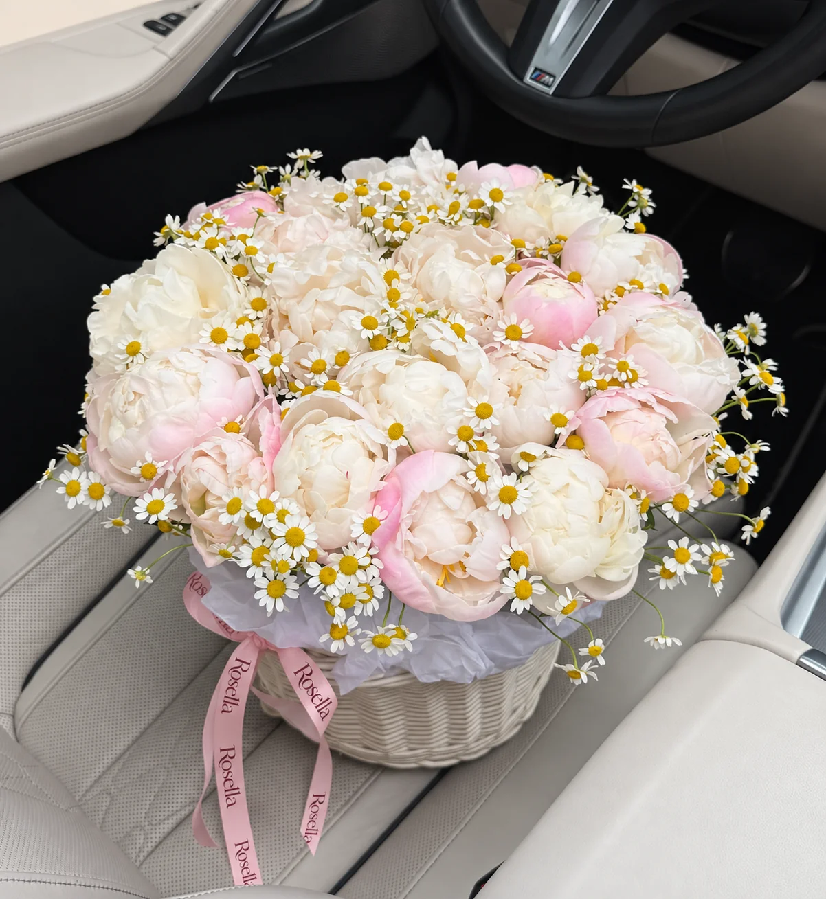 12 white peonies, 12 blush peonies & 155 chamomile blooms in a basket