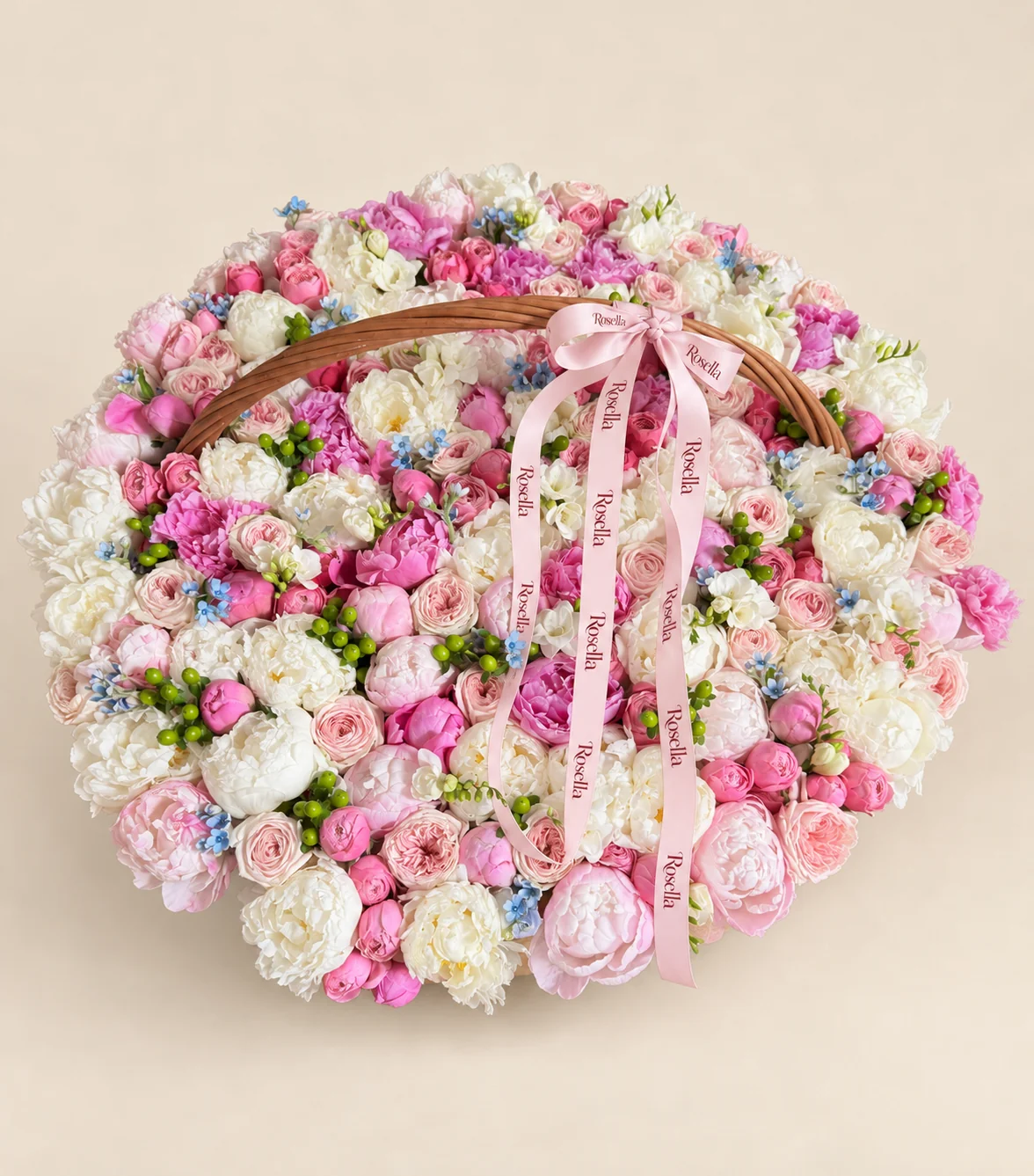 44 white peonies, 43 garden roses, 22 blush peonies, 21 pink peonies, 44 spray roses, 90 tweedia blooms & 10 freesias in a basket
