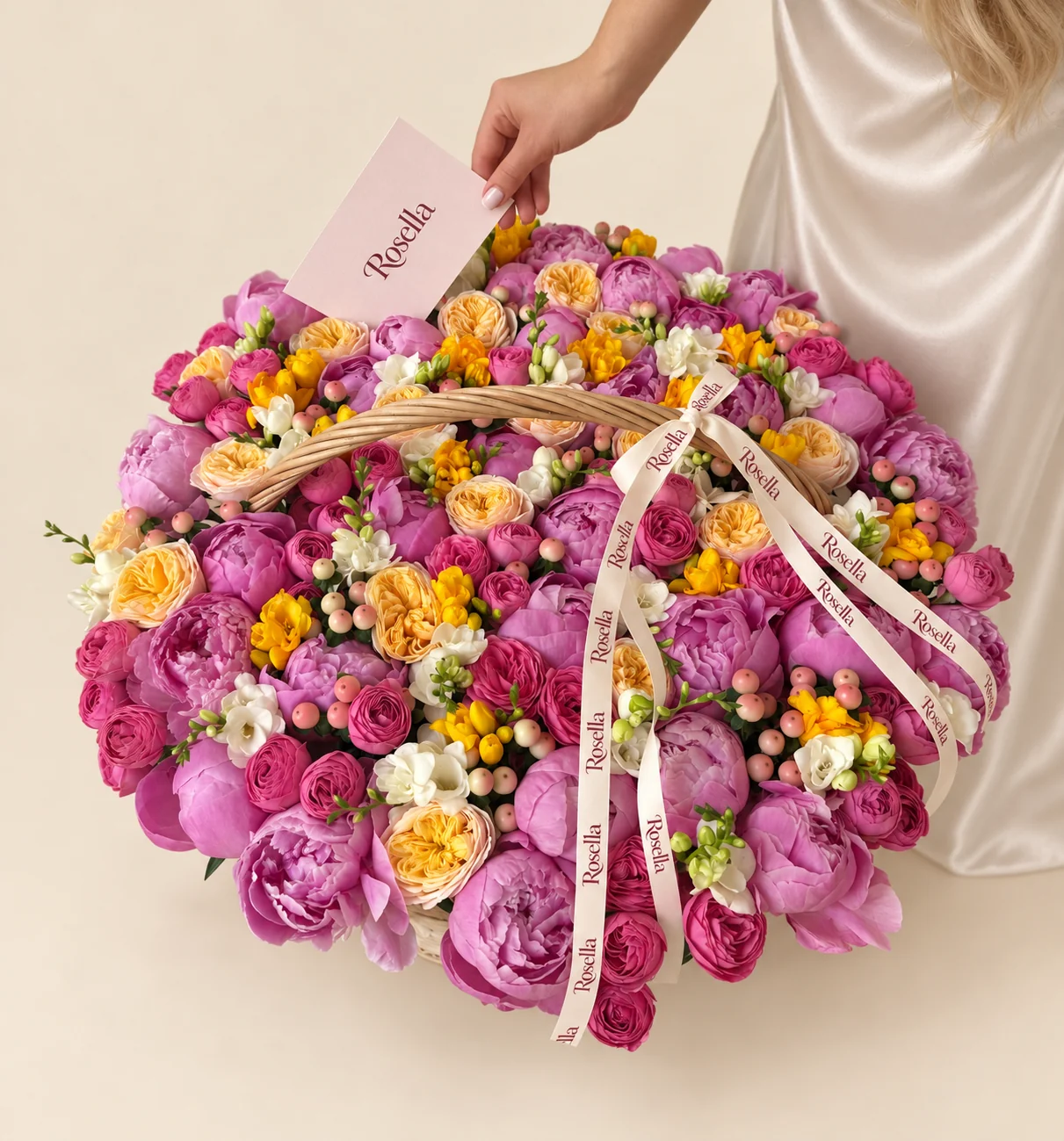 38 peonies, 21 garden roses, 43 spray roses, 14 white freesias & 14 yellow freesias in a basket
