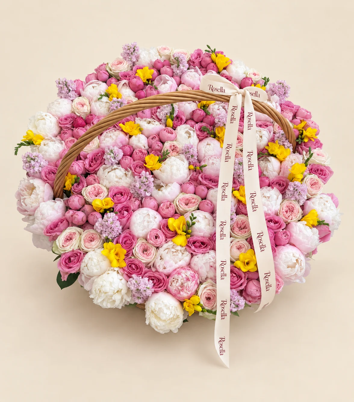 37 white peonies, 27 garden roses, 90 spray roses, 33 roses, 13 blush peonies, 13 stocks & 18 freesias in a basket