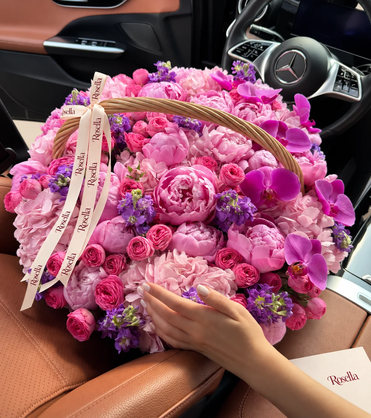 21 peonies, 10 hydrangeas, 41 spray roses, 8 stocks & 9 orchid blooms in a basket