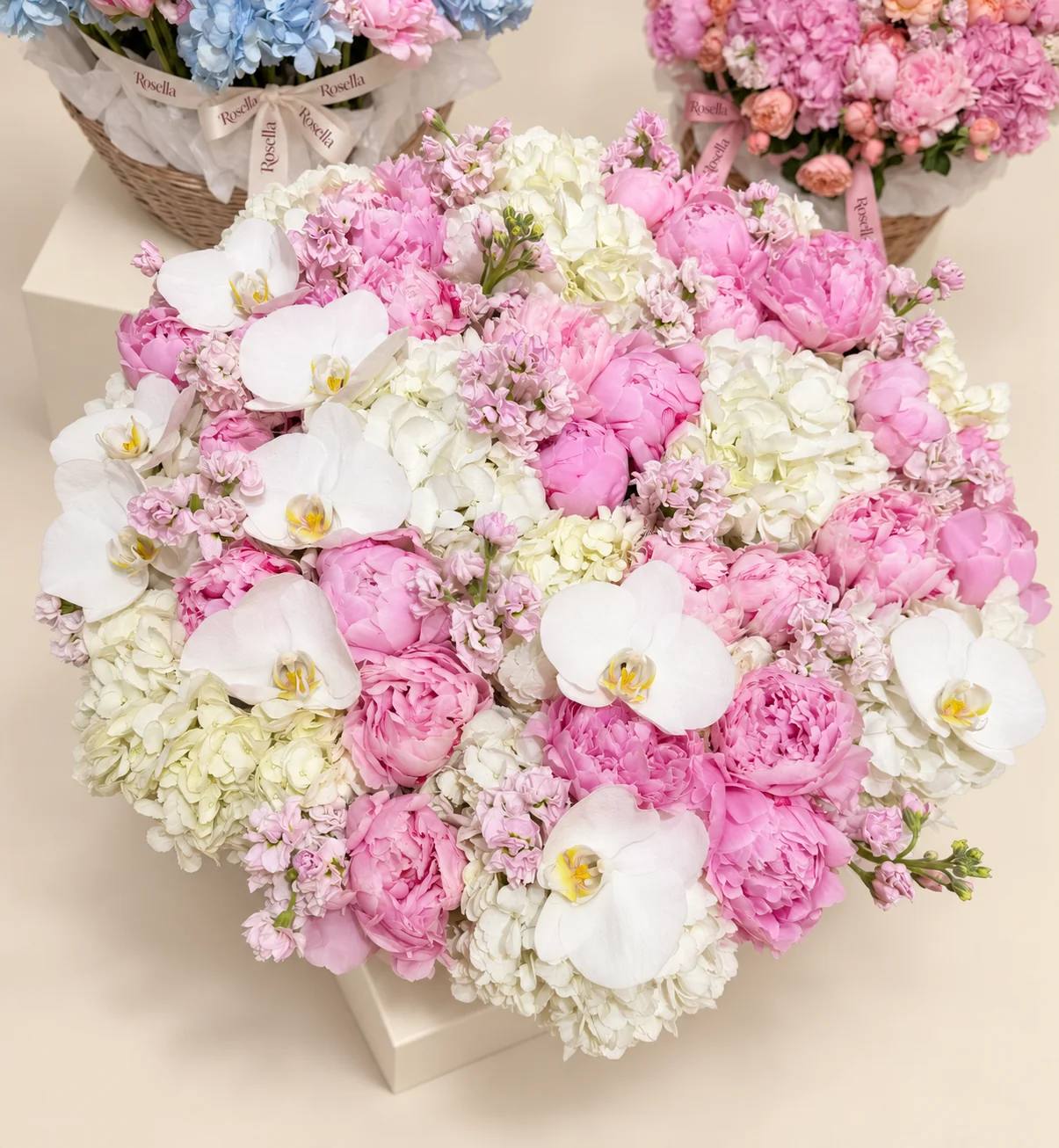 28 peonies, 12 hydrangeas, 13 stocks & 9 orchid blooms in a basket