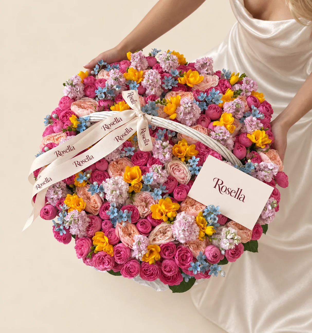 110 spray roses, 27 garden roses, 16 stocks, 115 tweedia blooms & 17 freesias in a basket