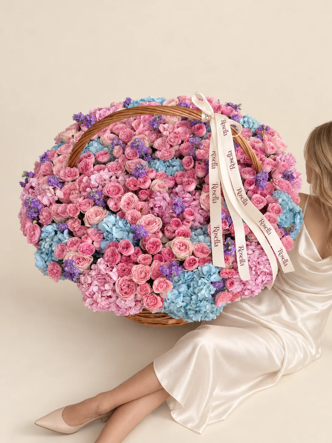 170 spray roses, 12 blue hydrangeas, 12 pink hydrangeas, 14 garden roses & 10 stocks in a basket