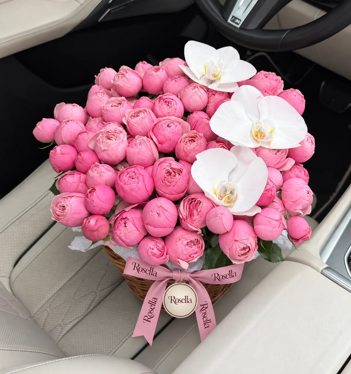 65 spray roses & 3 orchid blooms in a basket
