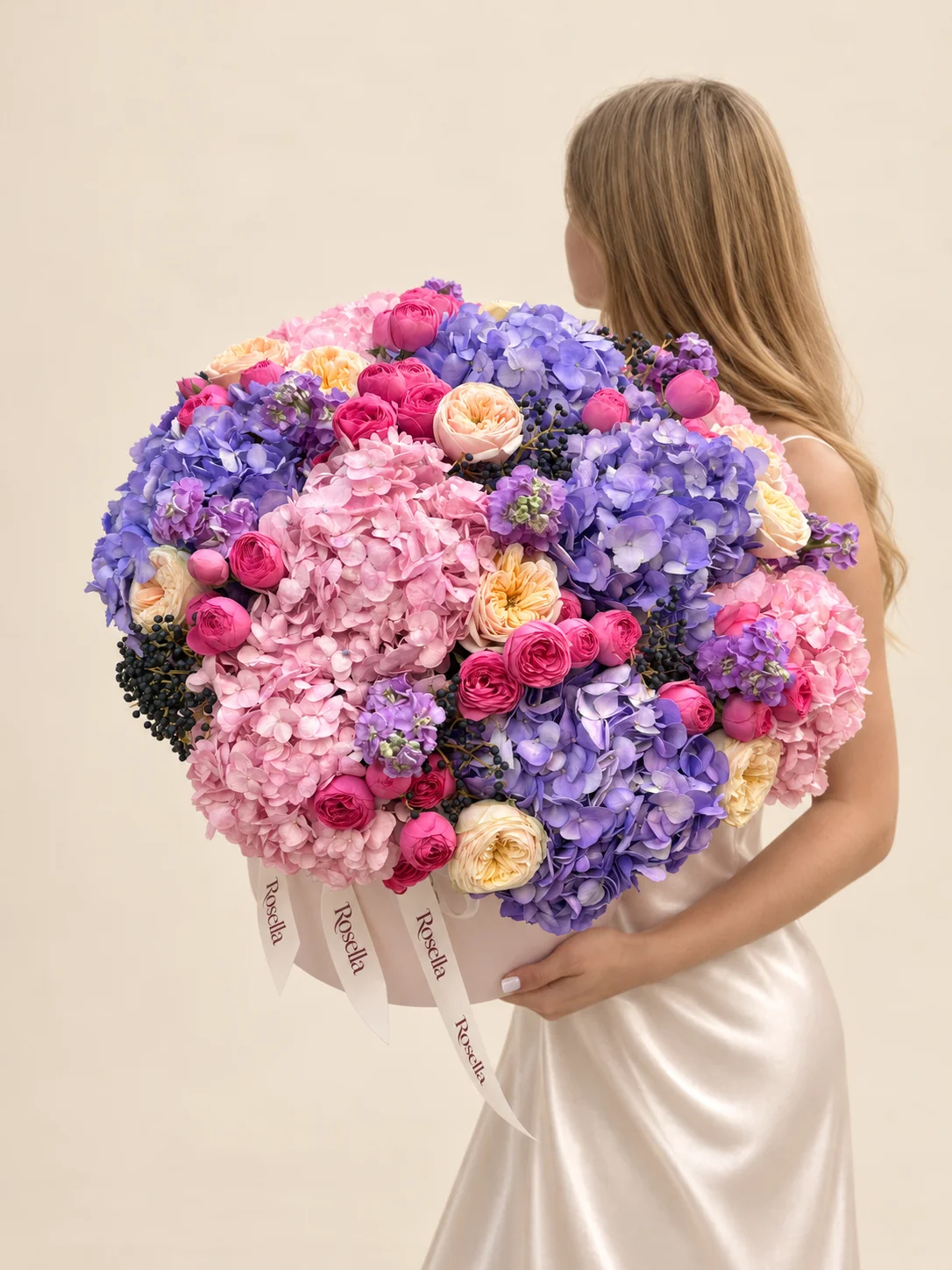 6 lavender hydrangeas, 6 pink hydrangeas, 10 garden roses, 36 spray roses & 4 stocks in a round box