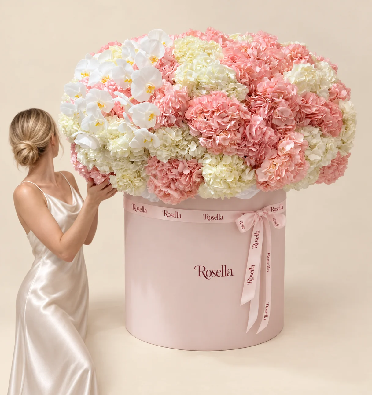 23 blush hydrangeas, 15 white hydrangeas & 18 orchid blooms in a round box