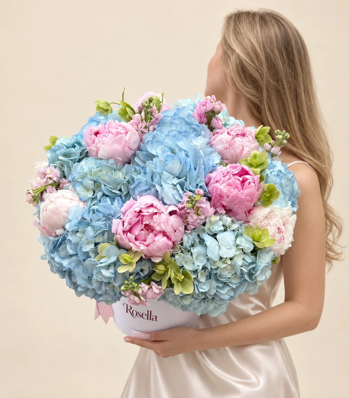 11 hydrangeas, 6 blush peonies, 3 pink peonies, 13 green hellebore & 3 stocks in a round box