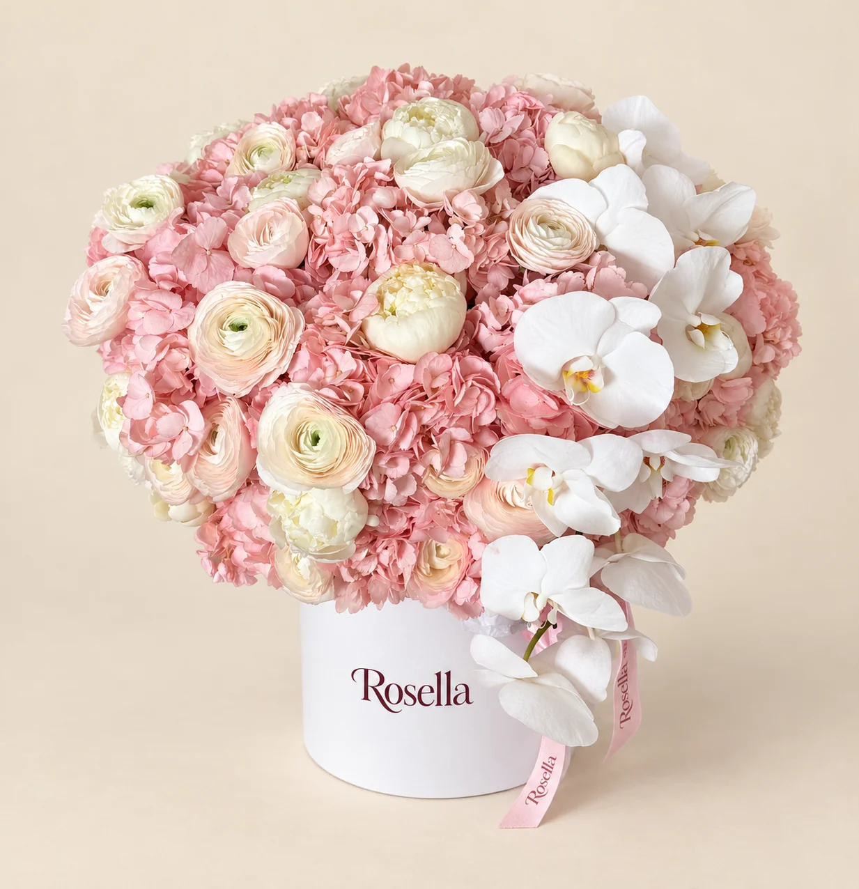 10 hydrangeas, 9 peonies, 11 blush ranunculus, 10 ivory ranunculus & 10 orchid blooms in a round box
